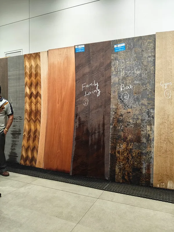 Hand-selected natural wood veneer flitches marked for family living, bar, and gym zones