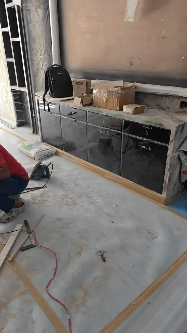 Window study desk framing with concealed electrical conduits and wall panelling support