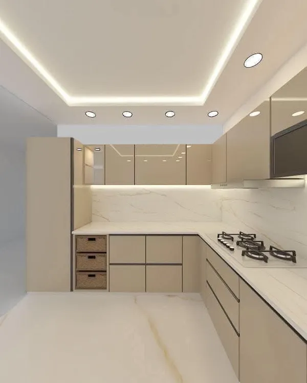 High-gloss beige modular kitchen with seamless quartz countertop, integrated hob, and perimeter LED ceiling