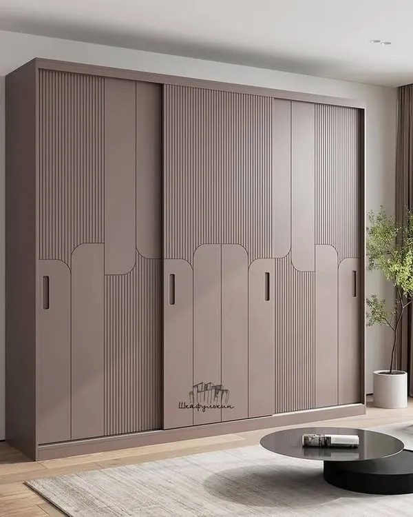 Three-door bedroom wardrobe with central full-length mirror and overhead storage lofts