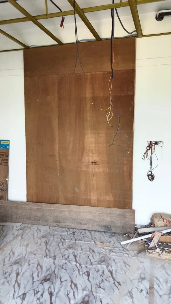 Precision edge-banding tape application around curved perimeter of wooden bed platform