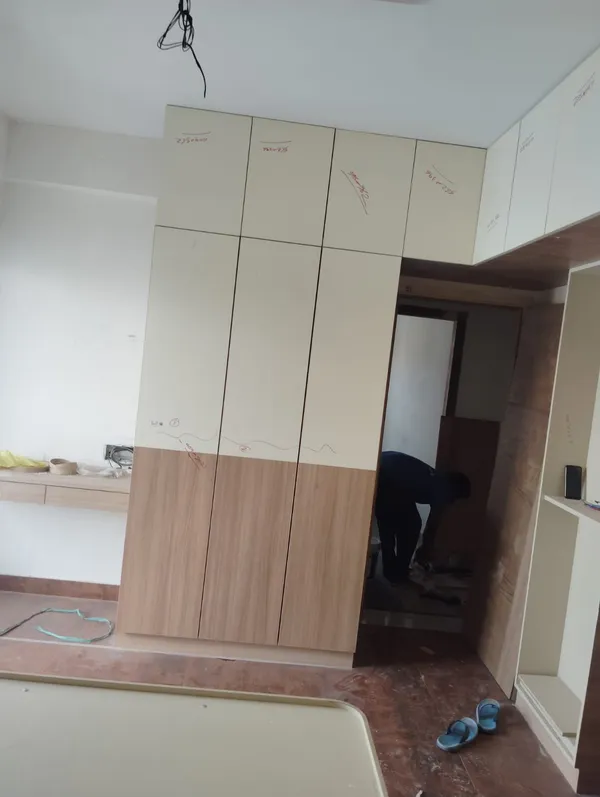 Vertical view of finished low-profile wooden bed base and wall-mounted floating drawer unit